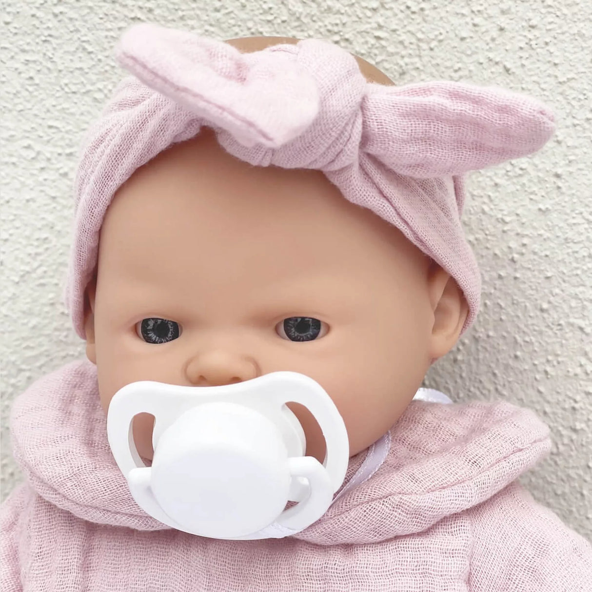 Petite poupée Nina 26 cm rose