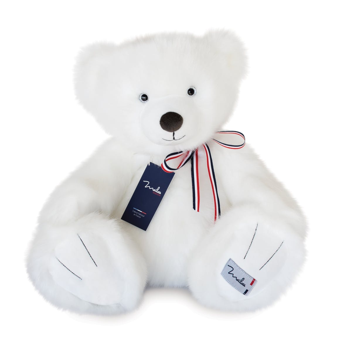 L'ours en peluche blanc neige